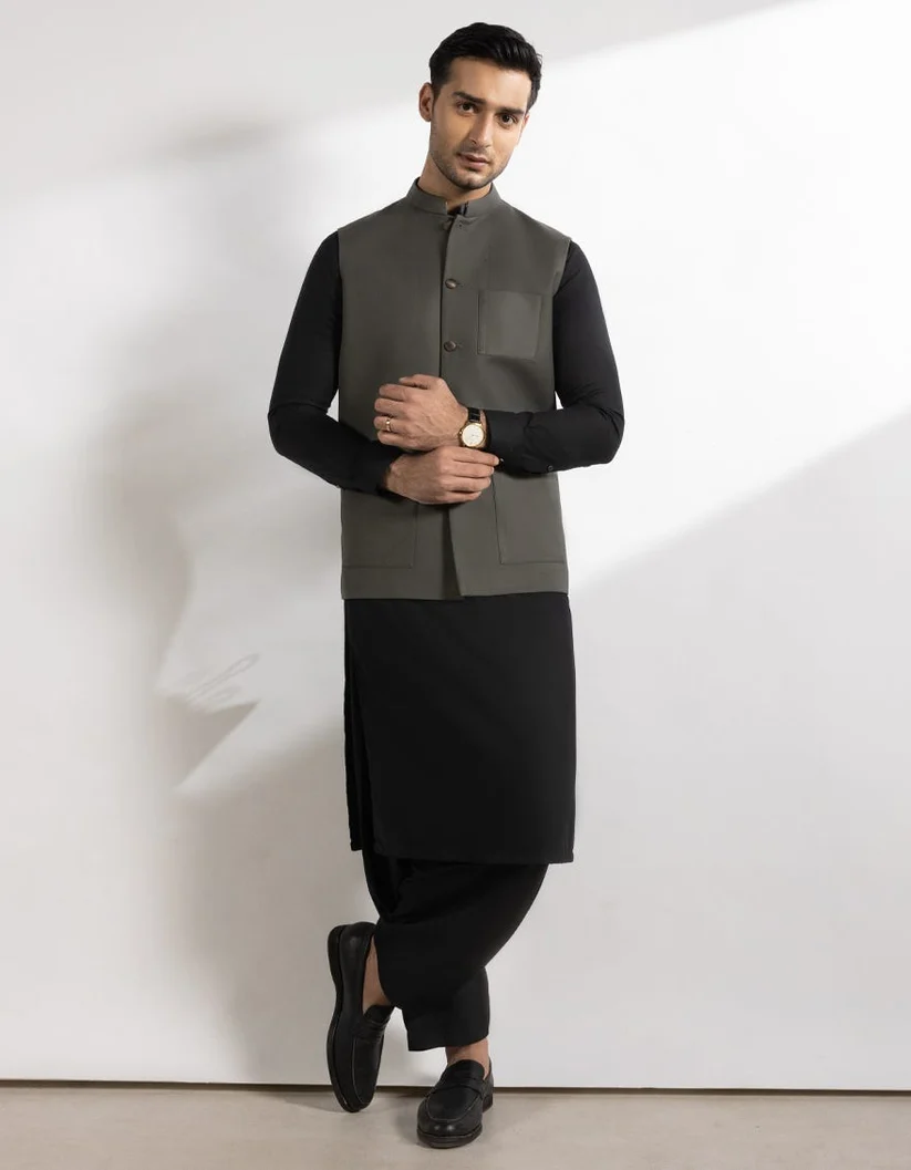 Model in an olive Atif's waistcoat
