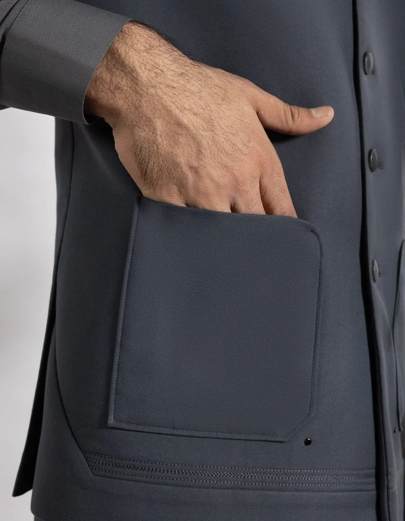 Waistcoat detailing — hand-finished pocket and stitch